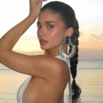 Kylie Jenner wore a little white Jacquemus dress with deep side cut-outs on vacation